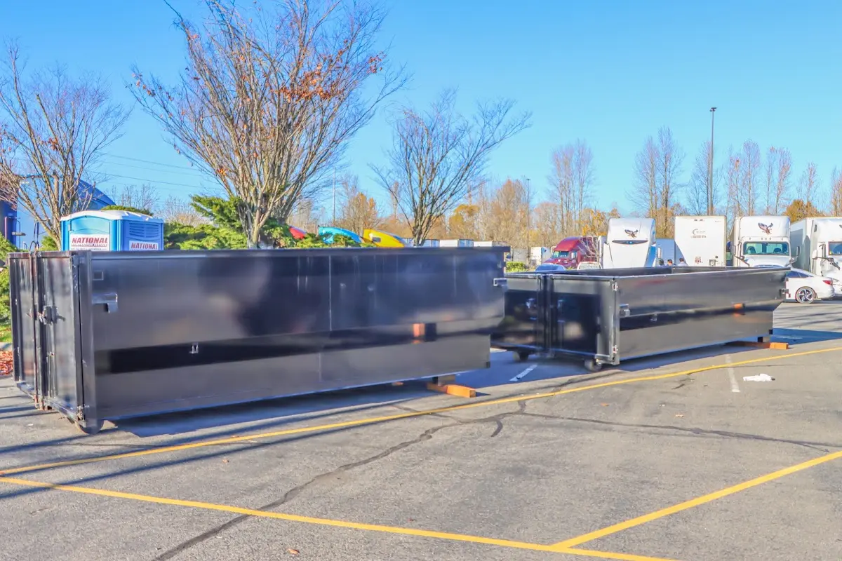 Professional dumpster rental service with roll-off container on residential driveway in Pataskala